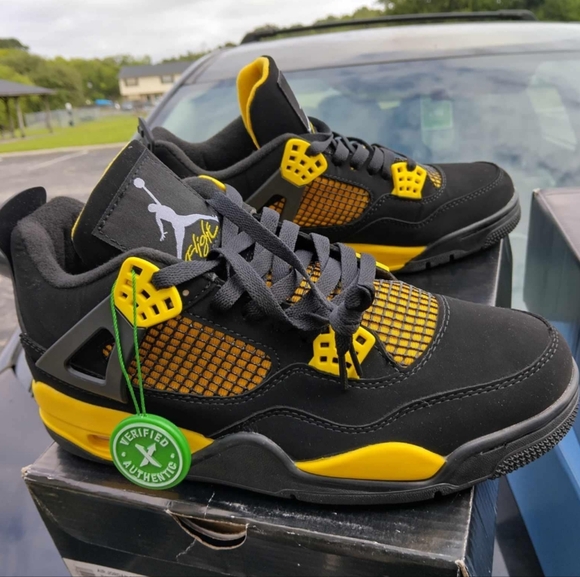 Air Jordan 4 Thunder Black and Yellow Athletic Sneakers - Picture 1 of 10